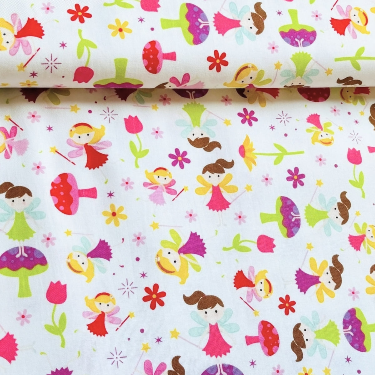 Fairies magic wands toadstools tulips flowers and starbursts on white Fairy Garden novelty fabric for girls quilts nursery décor and patchwork sewing projects