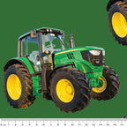Large green tractor fabric on solid green background, perfect for boys' quilting projects for farm lovers