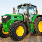 Green tractor panel fabric with detailed farm machinery, perfect for boys' quilting projects for farm lovers