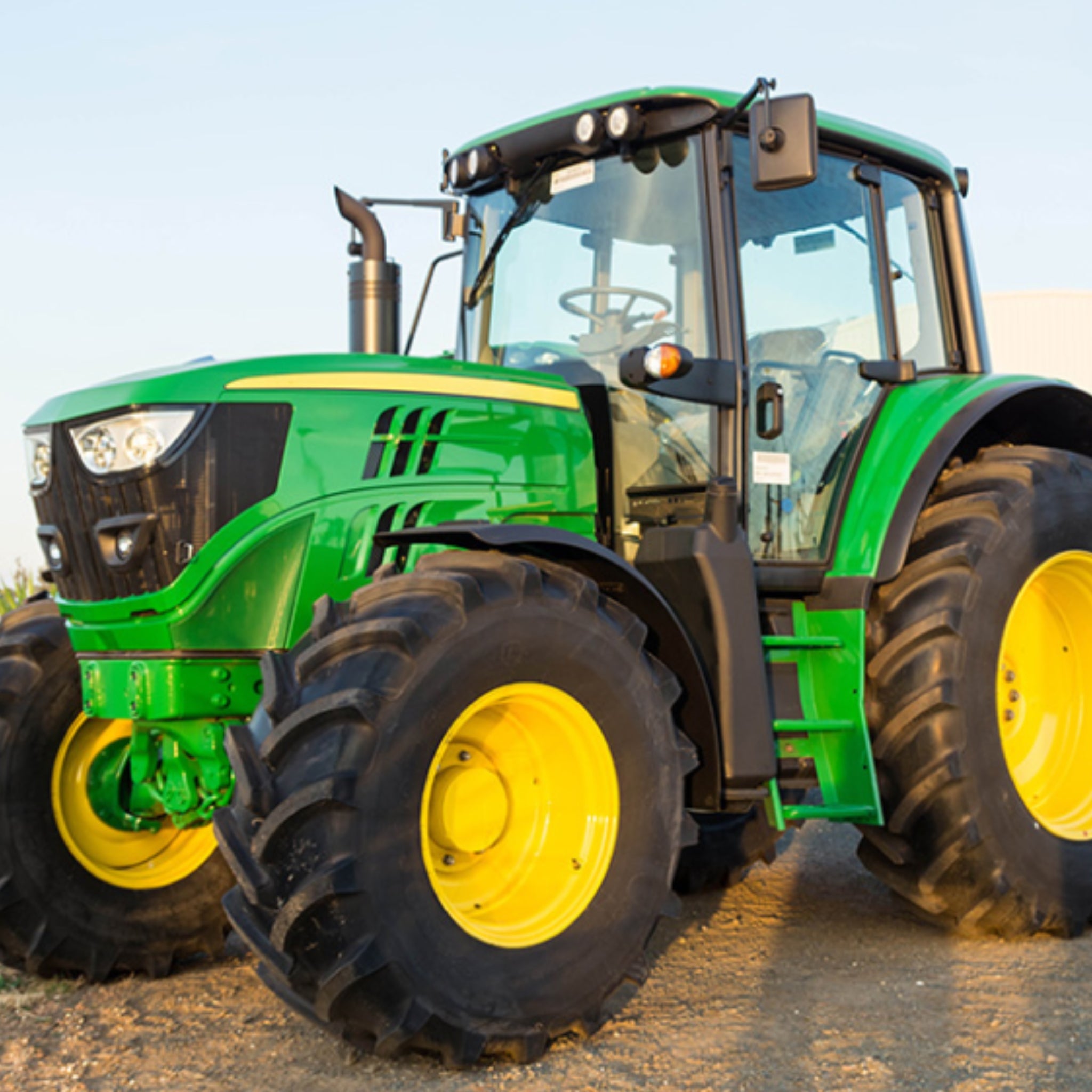 Green tractor panel fabric with detailed farm machinery, perfect for boys' quilting projects for farm lovers