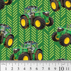 Green tractor toss fabric with patterned background, perfect for boys' quilting projects for farm lovers