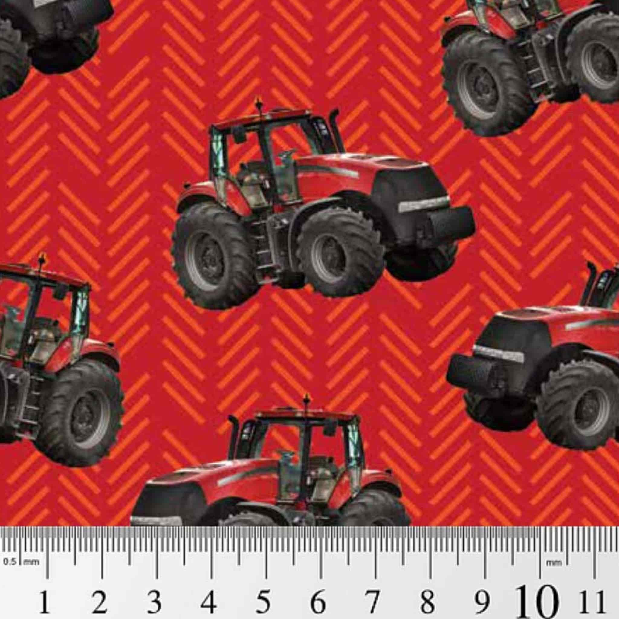 Red tractor toss fabric with patterned background, perfect for boys' quilting projects for farm lovers