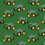 Green tractor toss fabric on solid green background, perfect for boys' quilting projects for farm lovers