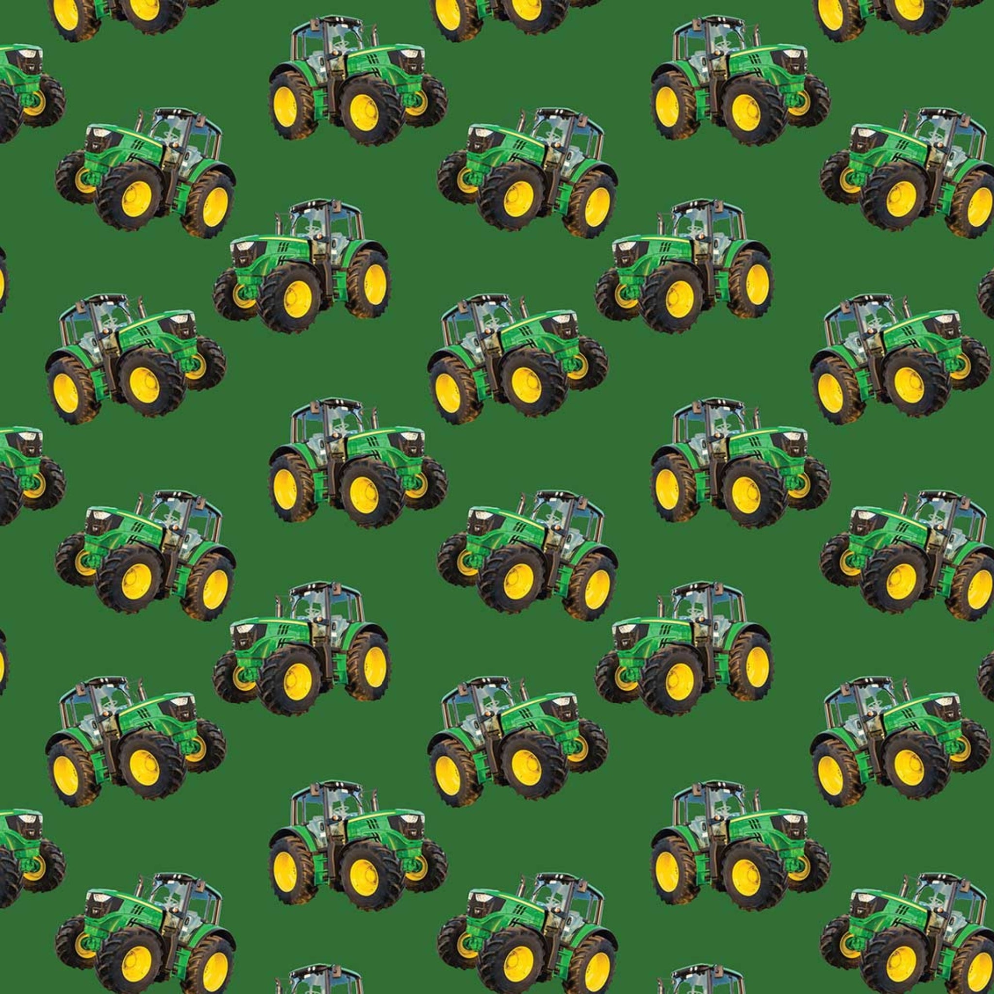 Green tractor toss fabric on solid green background, perfect for boys' quilting projects for farm lovers