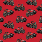 Red tractor toss fabric on solid red background, perfect for boys' quilting projects for farm lovers