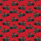 Red tractor toss fabric on solid red background, perfect for boys' quilting projects for farm lovers
