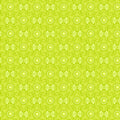 Lime green floral blender fabric with a geometric pattern of interlocking flowers for quilting patchwork sewing