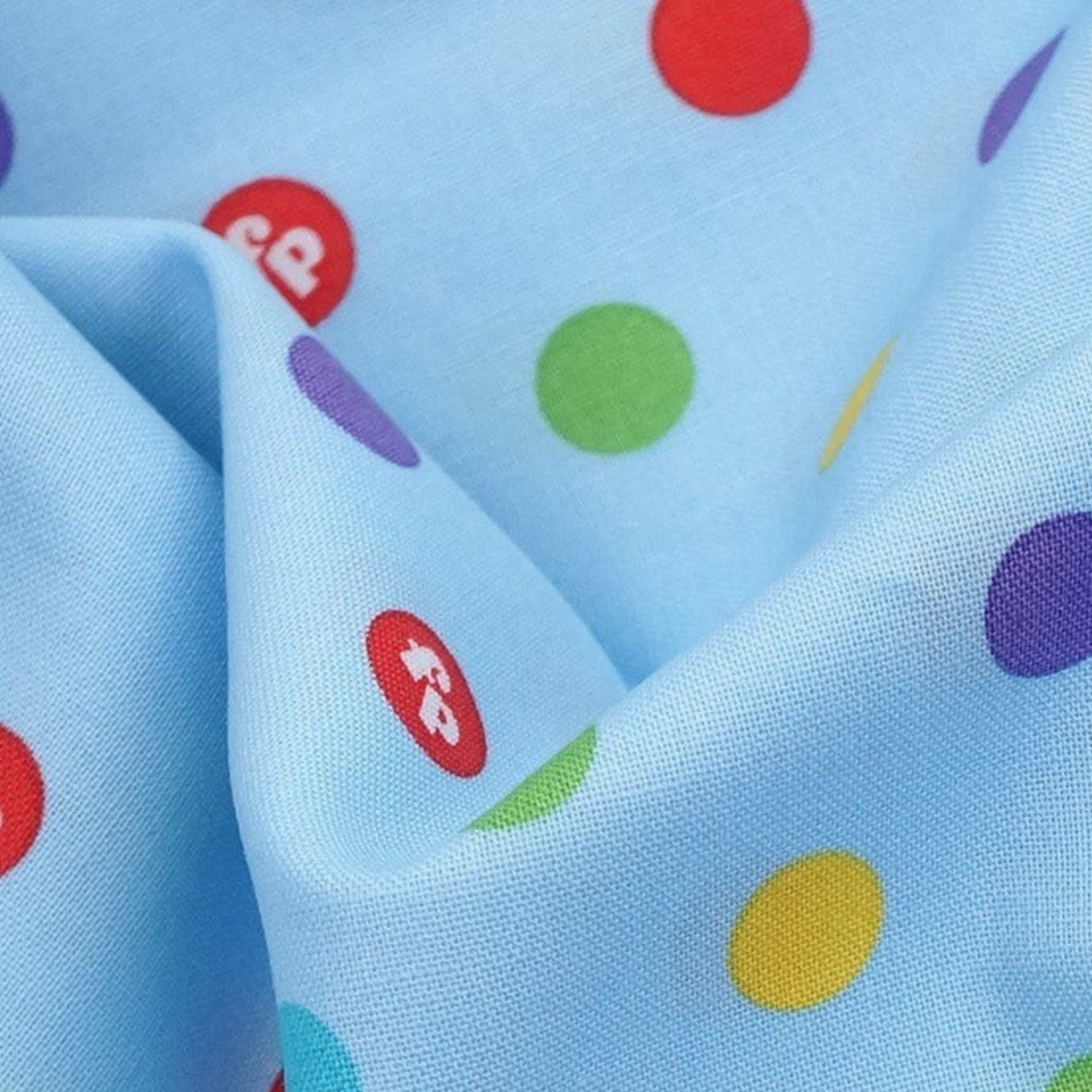 Rainbow multicolour dots sky blue novelty fabric for children's quilts play mats and nursery décor