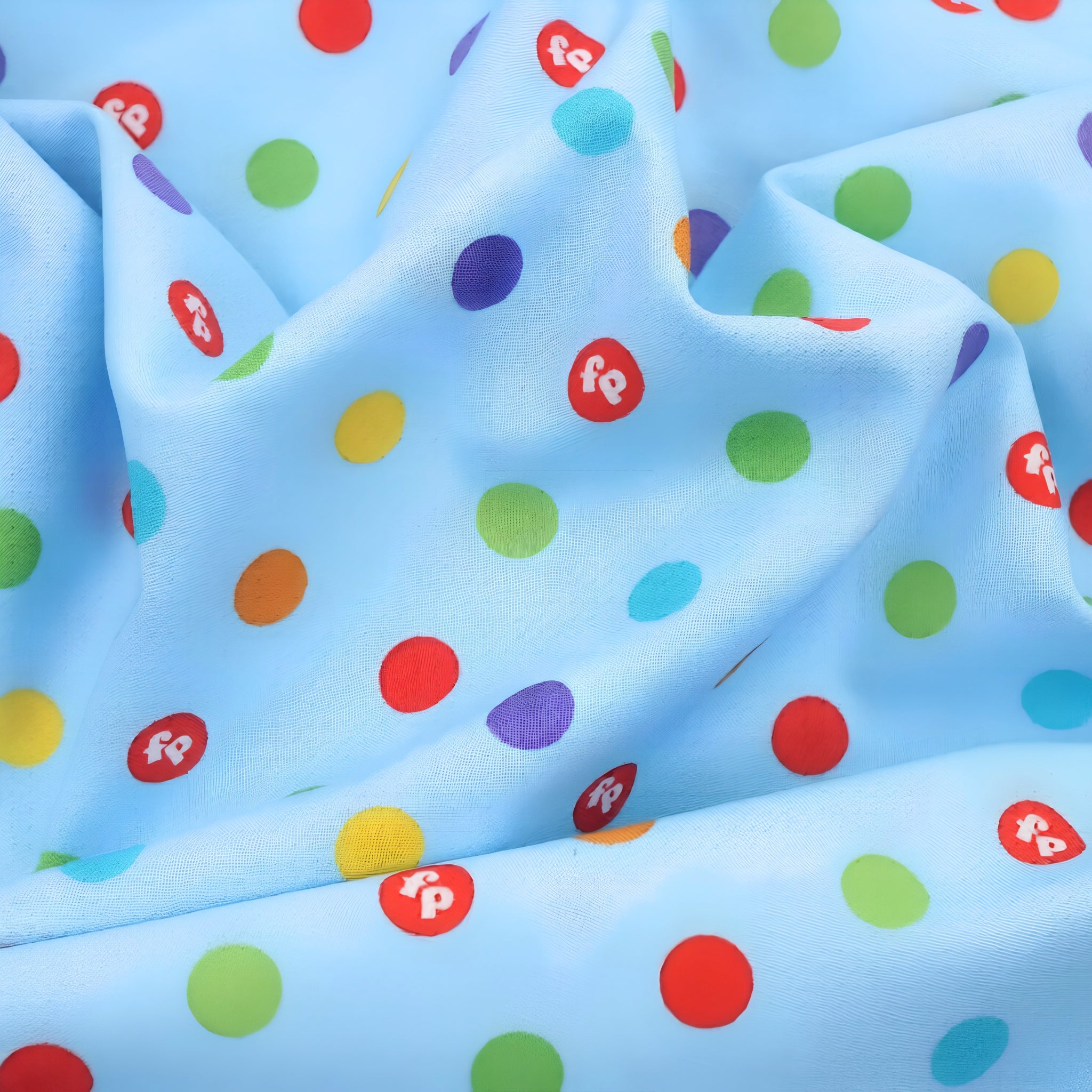 Rainbow multicolour spots sky blue novelty fabric for children's quilts play mats and nursery décor