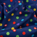 Rainbow multicolour polka dots deep navy novelty fabric for children's quilts play mats and nursery décor