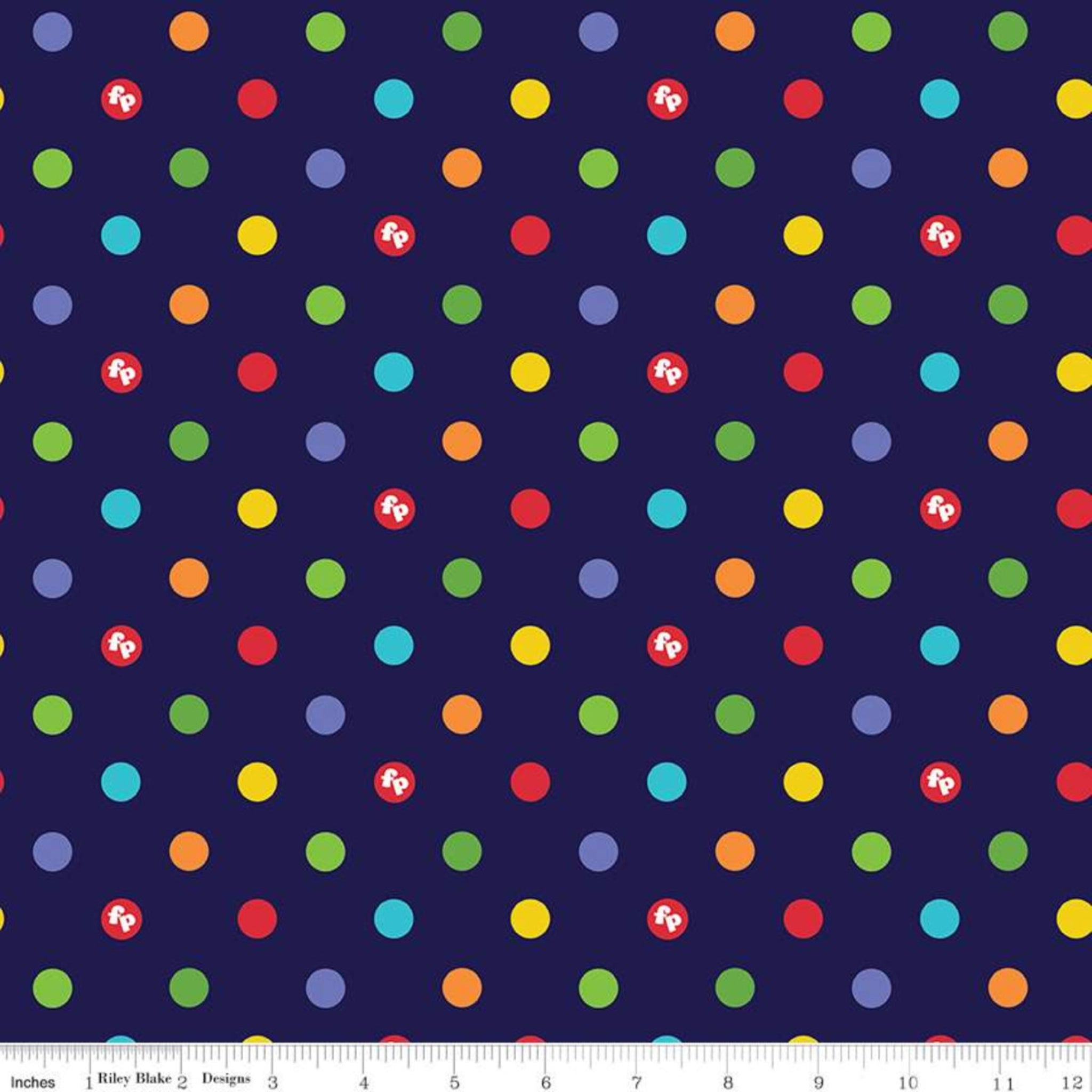 Rainbow coloured dots scattered on a navy blue quilting cotton fabric by Fisher-Price