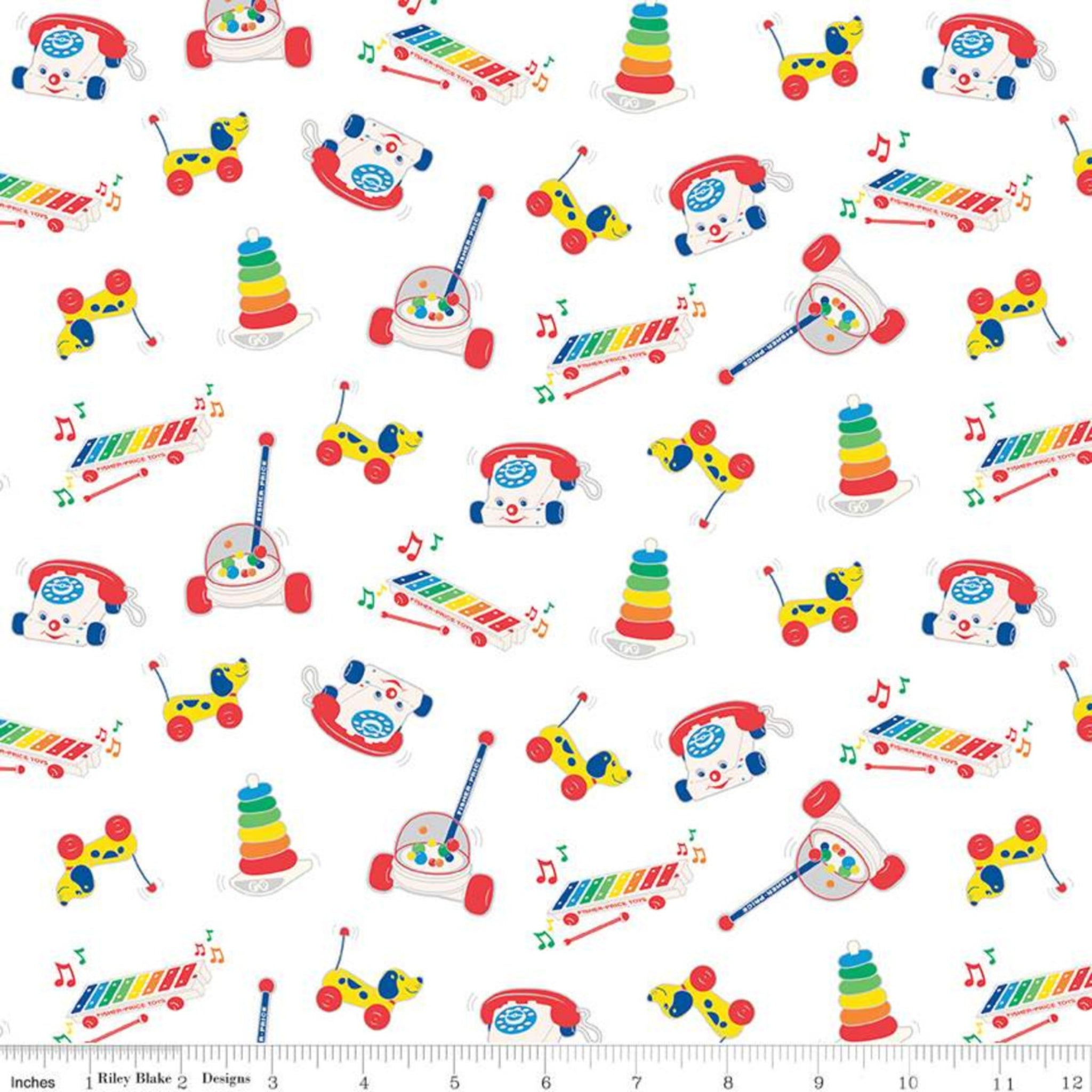 White quilting cotton with bright, tossed Fisher-Price classic toy motifs