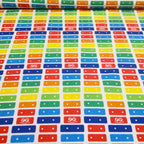 White fabric with a stripe pattern of the Fisher-Price Xylophone rainbow keys