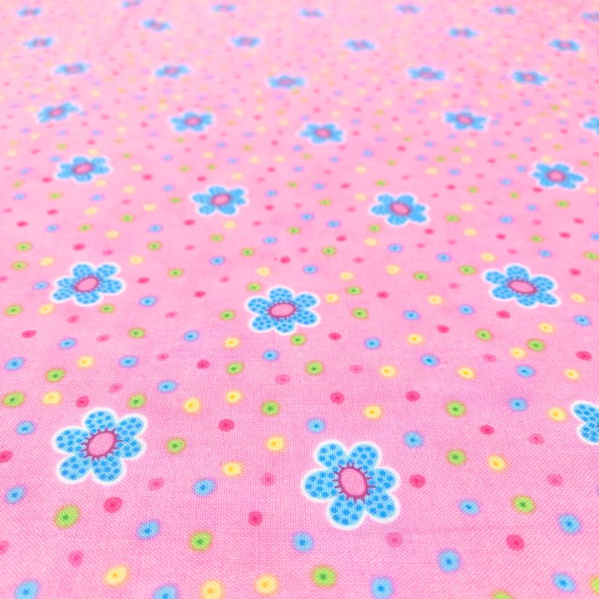 Tossed daisy flowers aqua pink novelty fabric for children's quilts girls' quilts and patchwork sewing projects