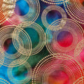 Gold metallic concentric circles on vibrant rainbow ombré fabric for elegant quilts, sophisticated home décor and patchwork sewing projects