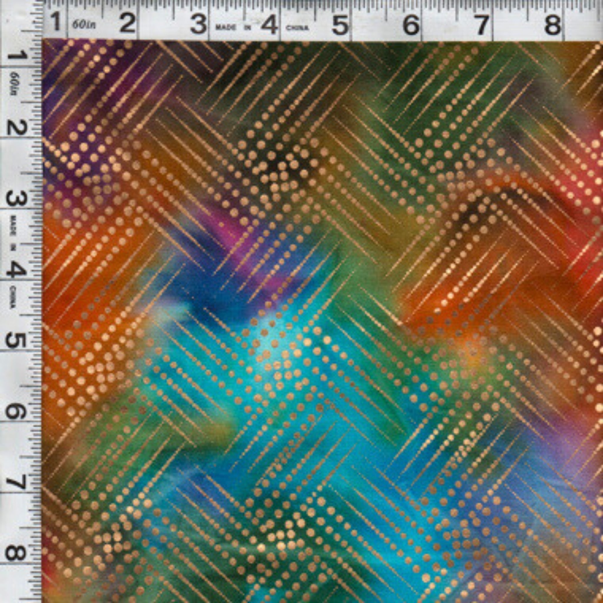 Gold metallic diagonal grid pattern on orange purple fuchsia teal green ombré fabric for elegant quilts and patchwork sewing projects