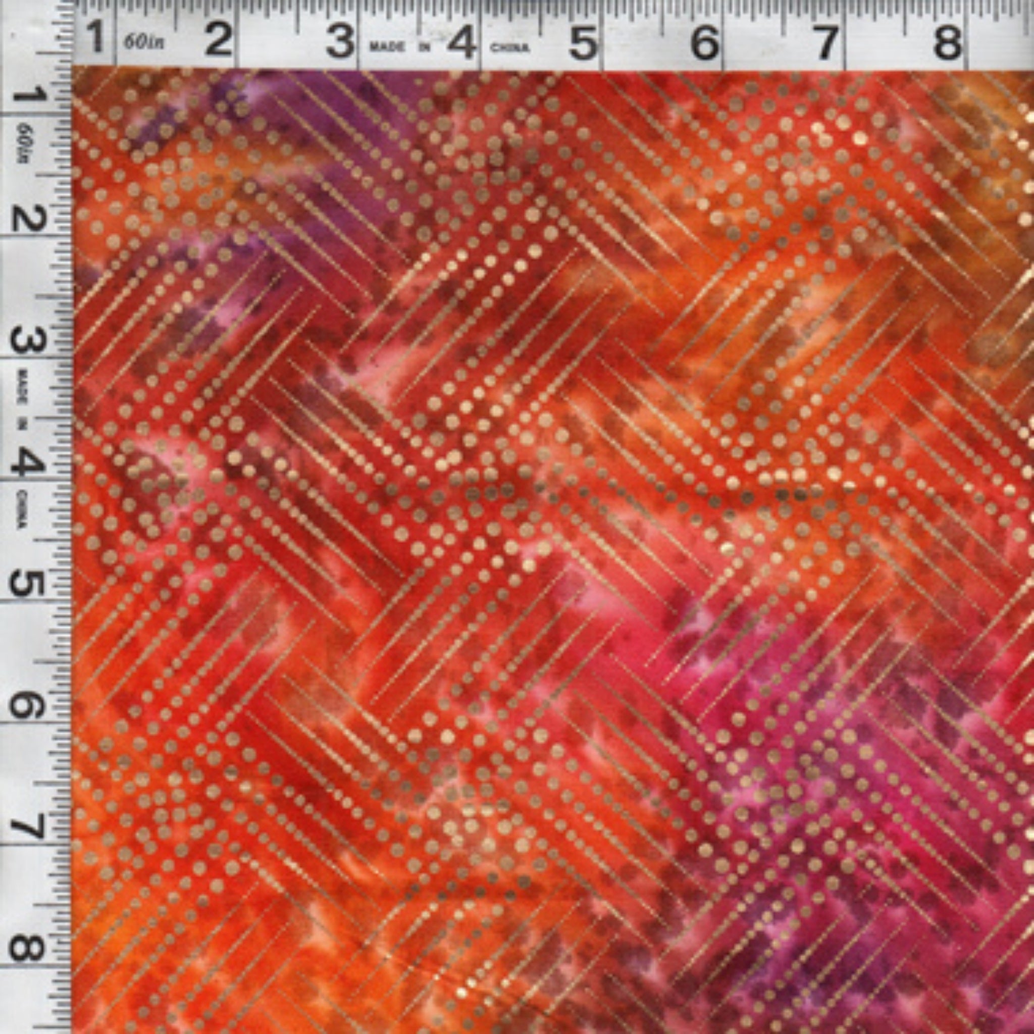 Gold metallic diagonal grid pattern on pink orange purple ombré fabric for elegant quilts and patchwork sewing projects