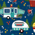 Quilting cotton cute caravans, dogs, and owls in a woodland camping scene on navy blue background.