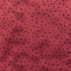 Tossed music notes mottled raspberry red novelty blender fabric for music quilts sashing music teacher gifts and patchwork projects