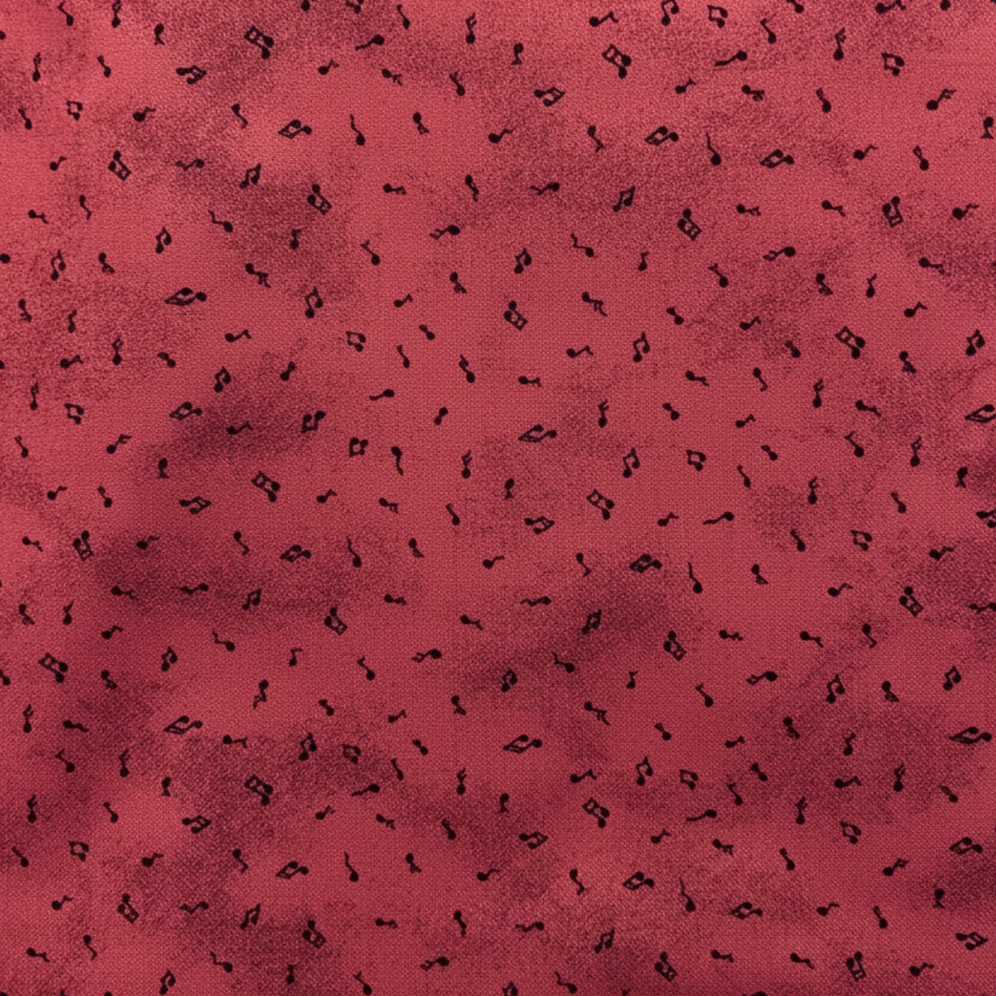 Tossed music notes mottled raspberry red novelty blender fabric for music quilts sashing music teacher gifts and patchwork projects