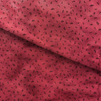 Tossed music notes mottled raspberry red novelty blender fabric for music quilts sashing music teacher gifts and patchwork projects