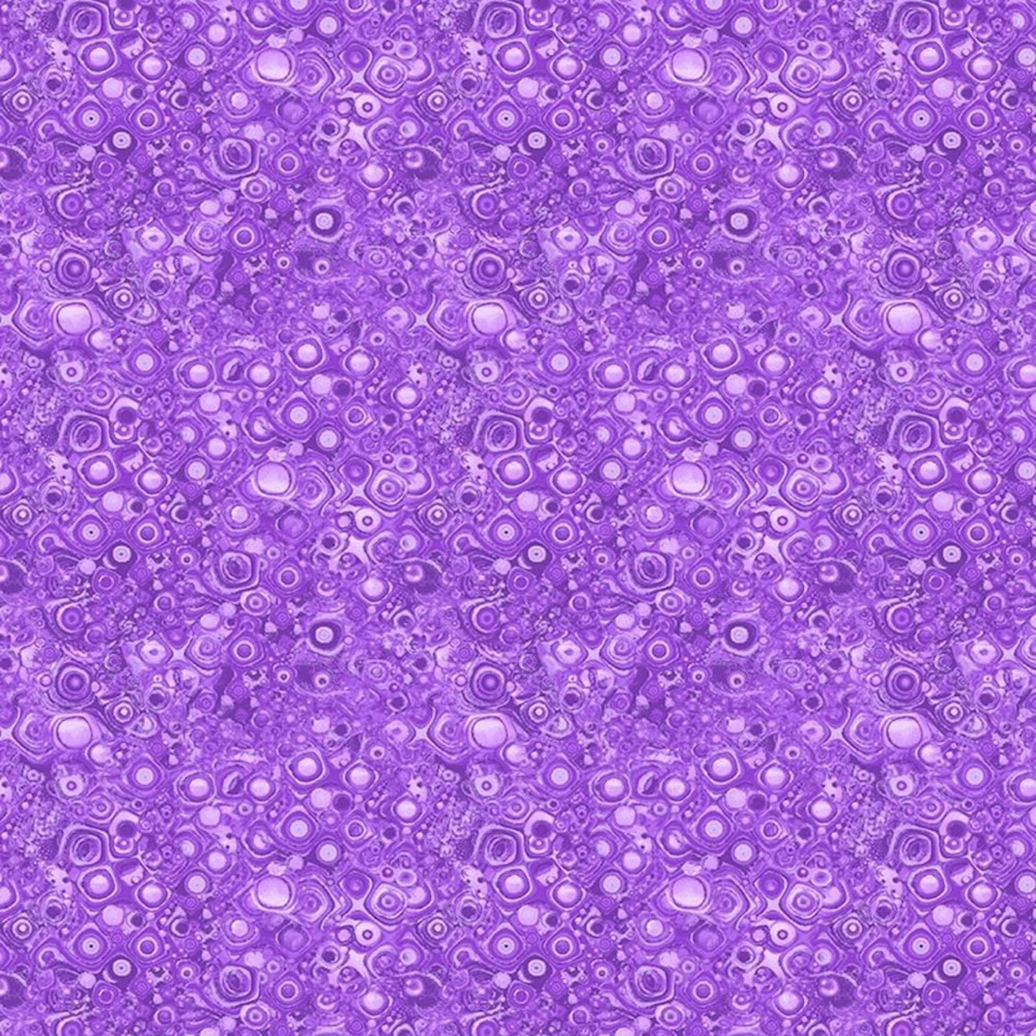 Tonal purple blender fabric with an all-over pattern of concentric circles, squares, and bubbles