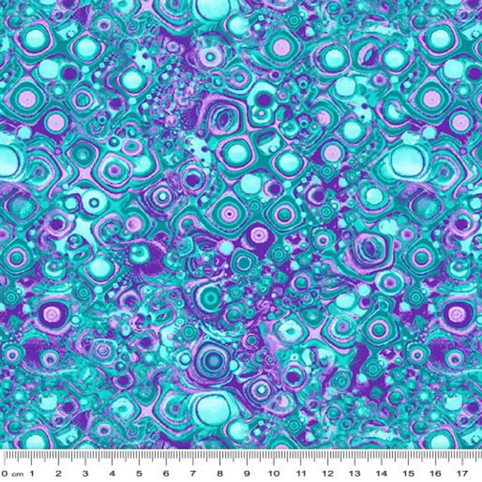 Teal and purple blender fabric with an all-over pattern of concentric circles, squares, and bubbles