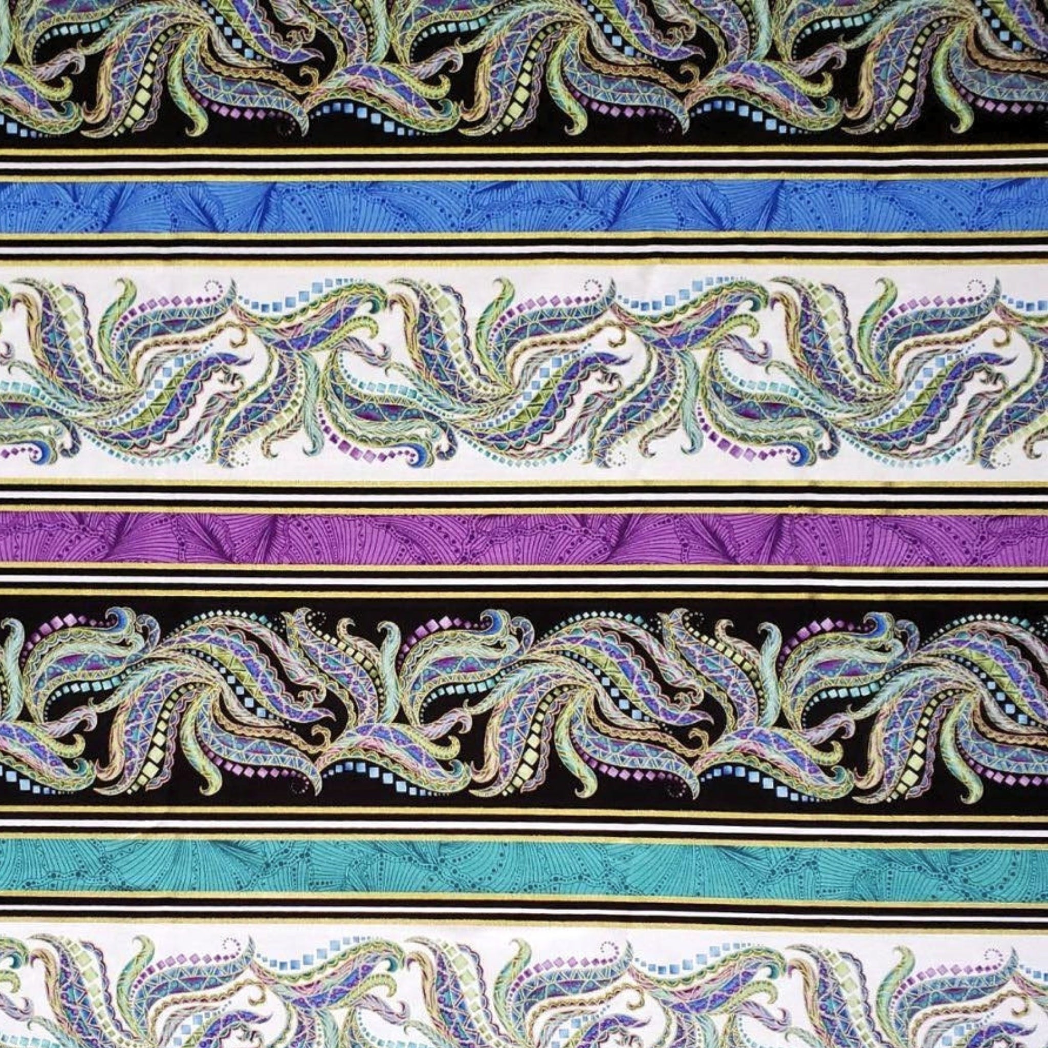 Striped horizontal fabric alternating with paisley and solid turquoise, purple, and black 