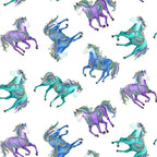 White fabric with galloping horses in turquoise, blue, and purple with gold metallic detail