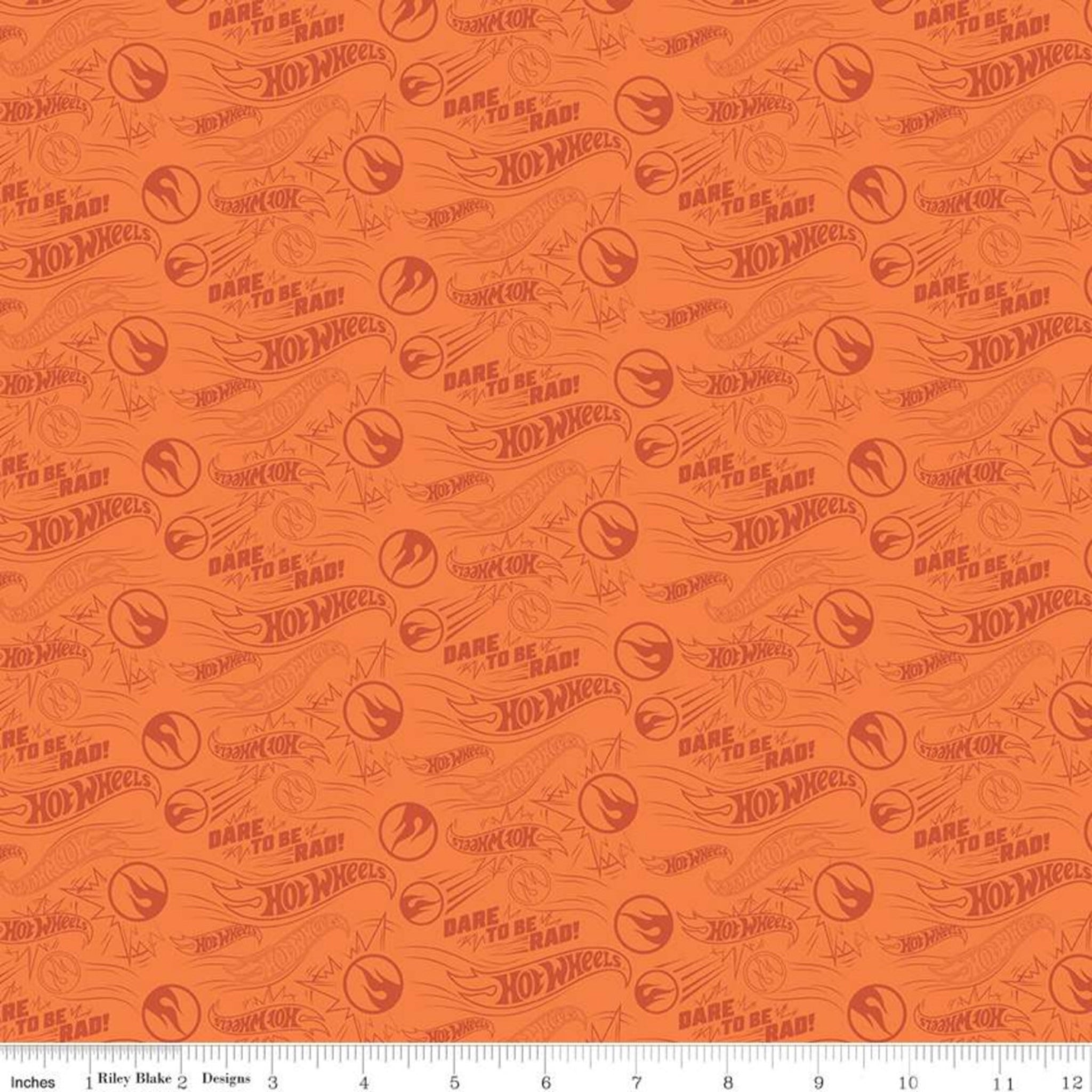 Hot Wheels pattern on orange fabric with measurement scale at the bottom.