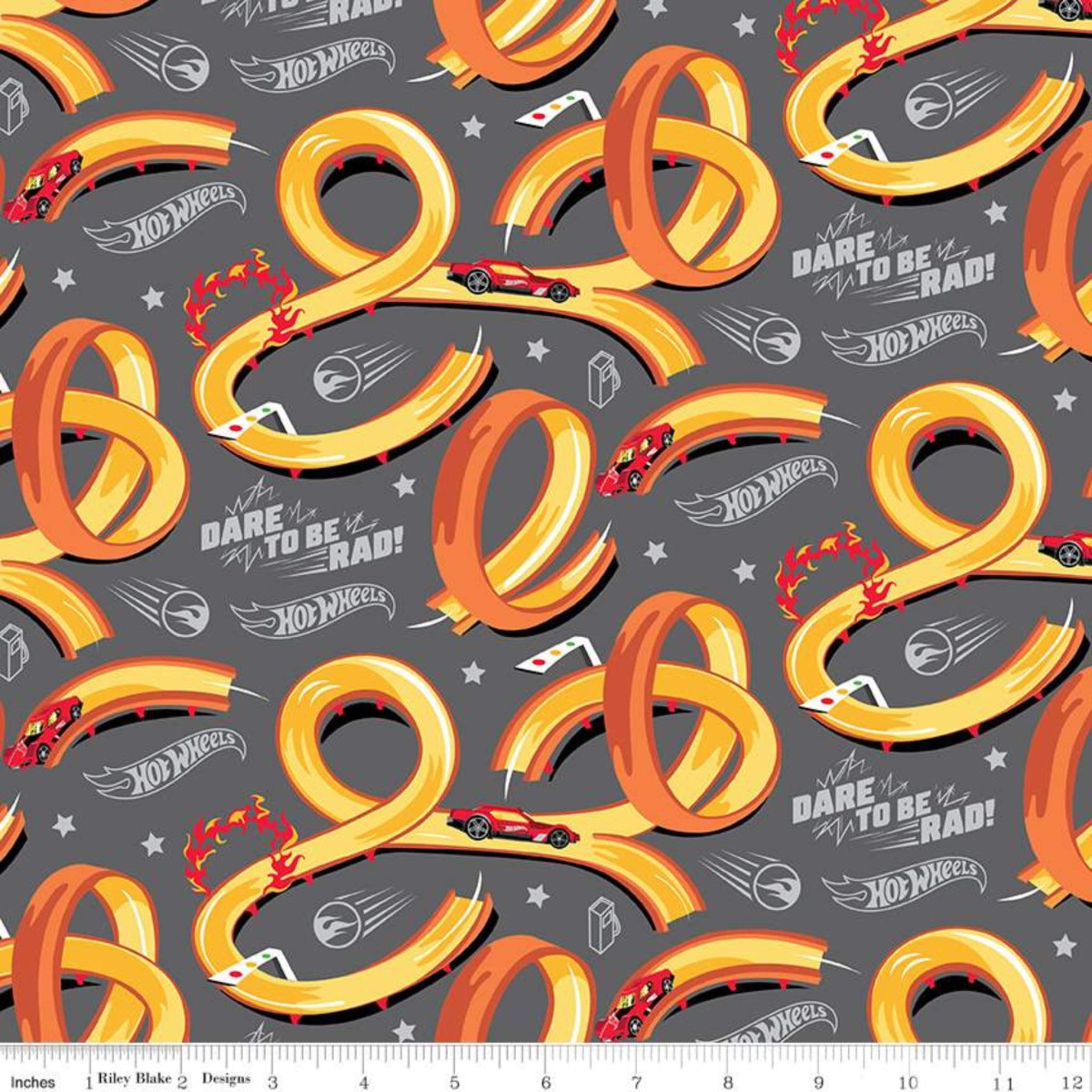 Hot Wheels racing track loops and race cars on grey quilting cotton for boys projects