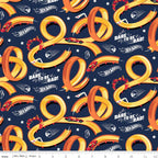 Hot Wheels racing track loops on navy blue quilting cotton for boys projects