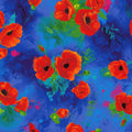Red poppies on blue background fabric for feature quilts and patchwork sewing projects