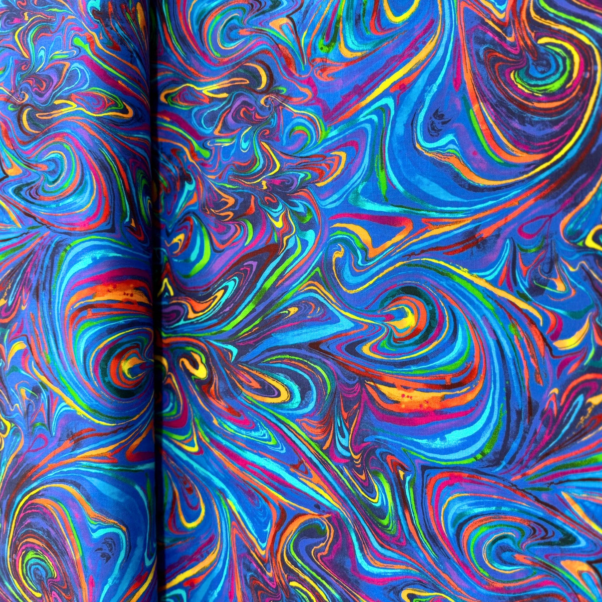 Rainbow marbled swirl blender blue turquoise purple pink red orange yellow lime green digital print fabric for feature quilts bags and bold patchwork sewing projects