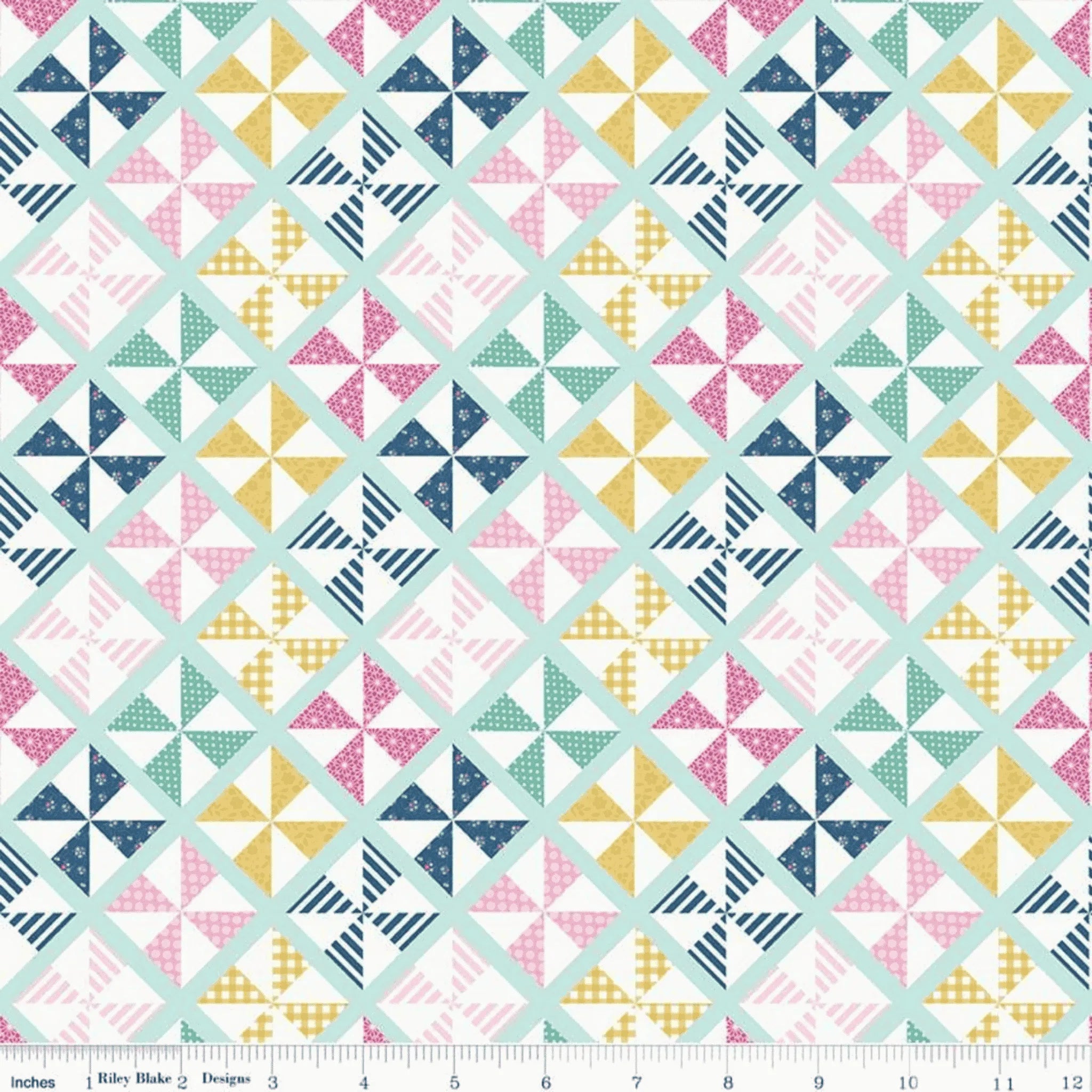 Geometric pinwheel quilting cotton fabric blender in mint, pink, navy, and yellow patchwork pattern