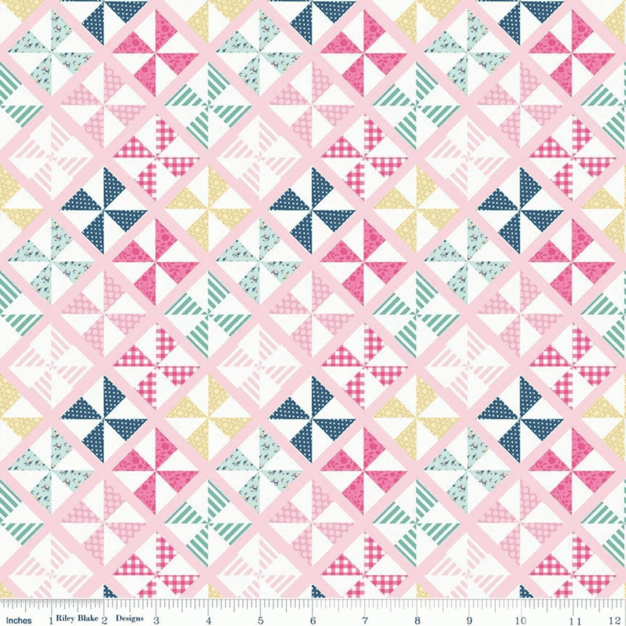 Geometric pinwheel quilting cotton fabric blender in mint, pink, navy, and yellow patchwork pattern