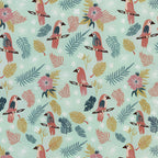 Dusty rose parrots tropical palm fronds monstera leaves hibiscus flowers mint background novelty quilting fabric for tropical quilts boho nursery and bird lover sewing projects