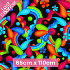 Bold geometric neon paisley swirls teardrop shapes daisy flowers and dots in rainbow colours on black background quilting fabric for stack and whack quilts tote bags and cushions