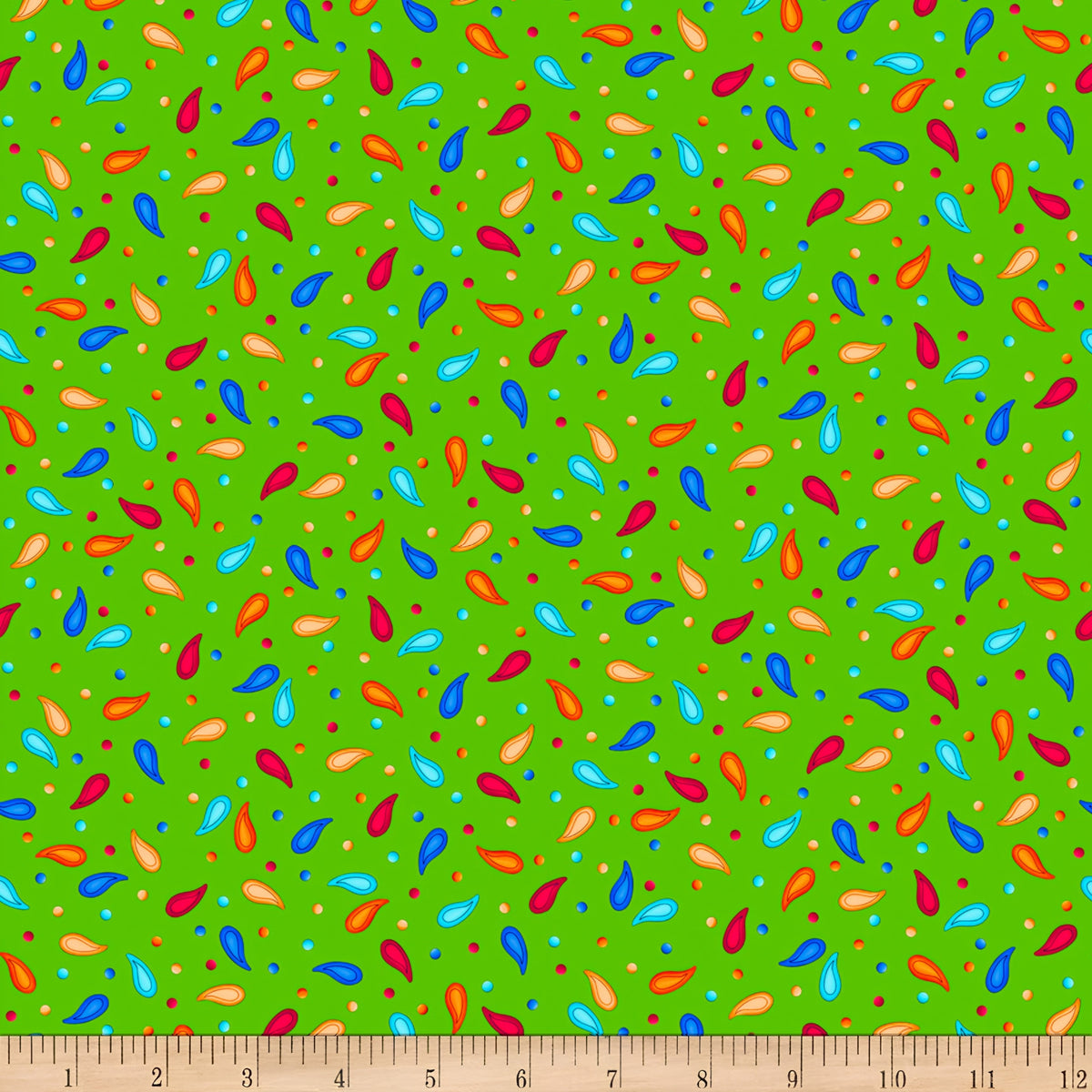 Scattered rainbow paisley teardrop shapes and coloured dots on lime green background coordinate quilting fabric for bold quilts tote bags and bright sewing projects