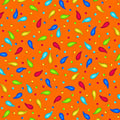 Scattered rainbow paisley teardrop shapes and coloured dots on vivid orange background coordinate quilting fabric for bold