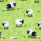 White and black sheep novelty print bright green meadow yellow flowers kids fabric for children's quilts baby quilts nursery décor patchwork projects
