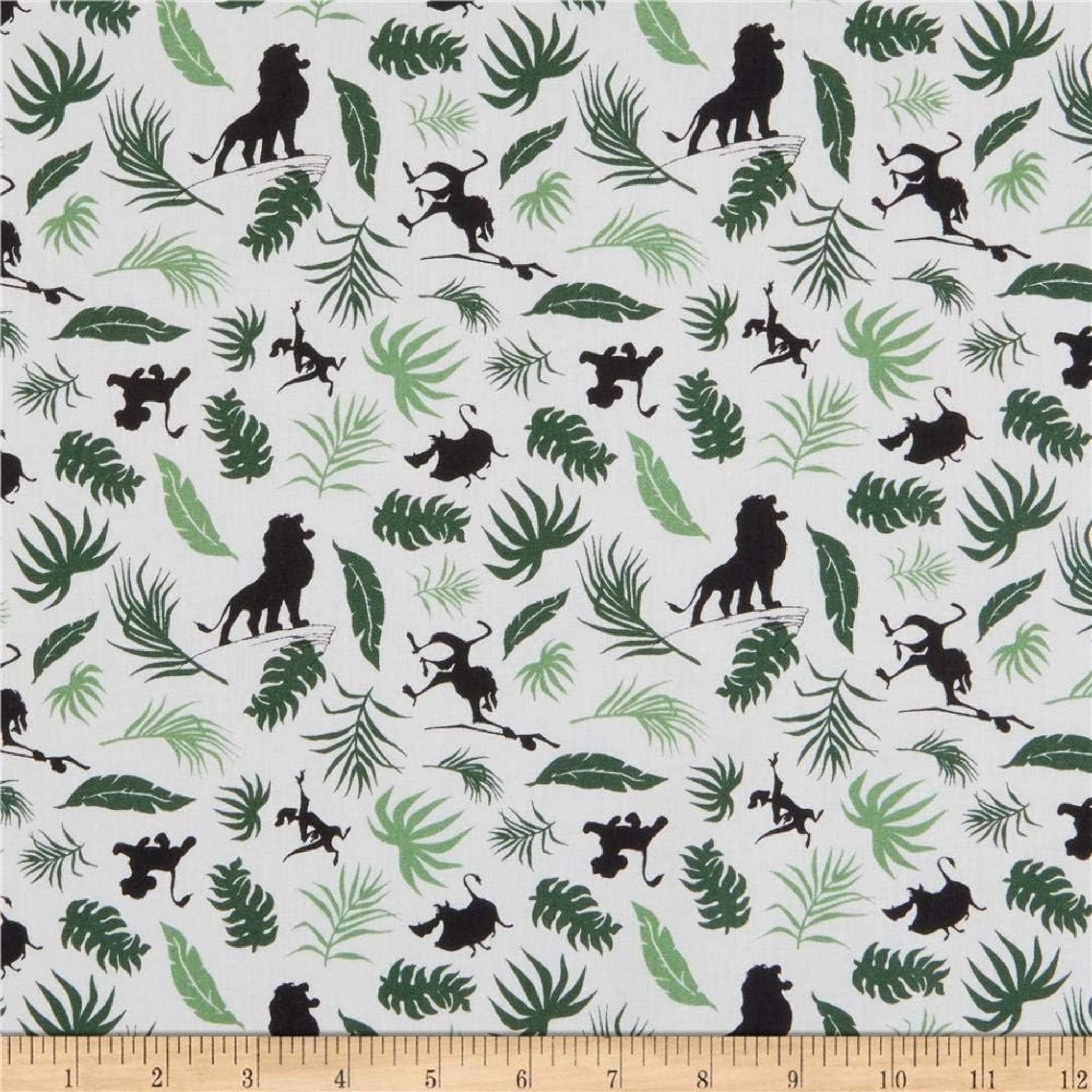 Disney Lion King character silhouettes tropical leaves white fabric for kids' quilts, jungle-themed projects and patchwork sewing projects