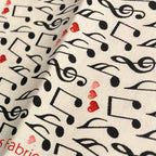 Tossed music notes treble clefs red pink hearts cream white novelty music fabric for music lovers quilts Valentine's gifts and patchwork sewing