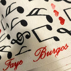 Tossed music notes treble clefs red pink hearts cream white novelty music fabric for music lovers quilts Valentine's gifts and patchwork sewing
