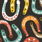 Lucky horseshoes paisley stars flowers colourful black fabric for Western horse-themed quilts bags and riding accessories