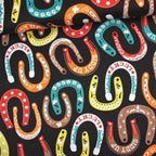 Lucky horseshoes paisley stars flowers colourful black fabric for Western horse-themed quilts bags and riding accessories