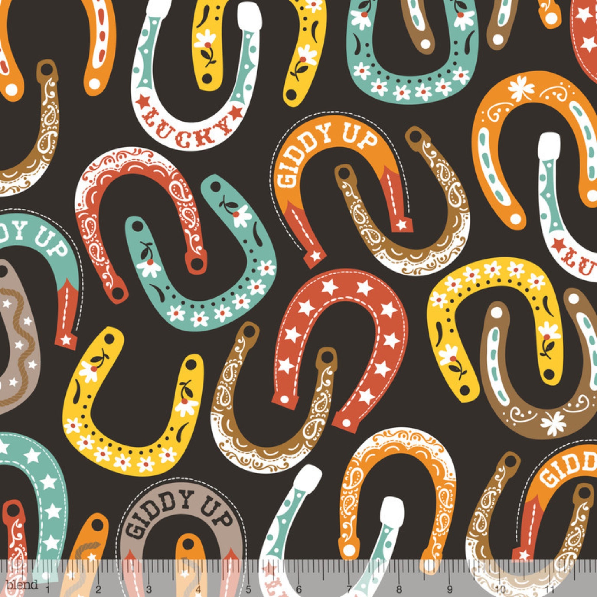 Lucky horseshoes paisley stars flowers colourful black fabric for Western horse-themed quilts bags and riding accessories