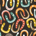Lucky horseshoes paisley stars flowers colourful black fabric for Western horse-themed quilts bags and riding accessories