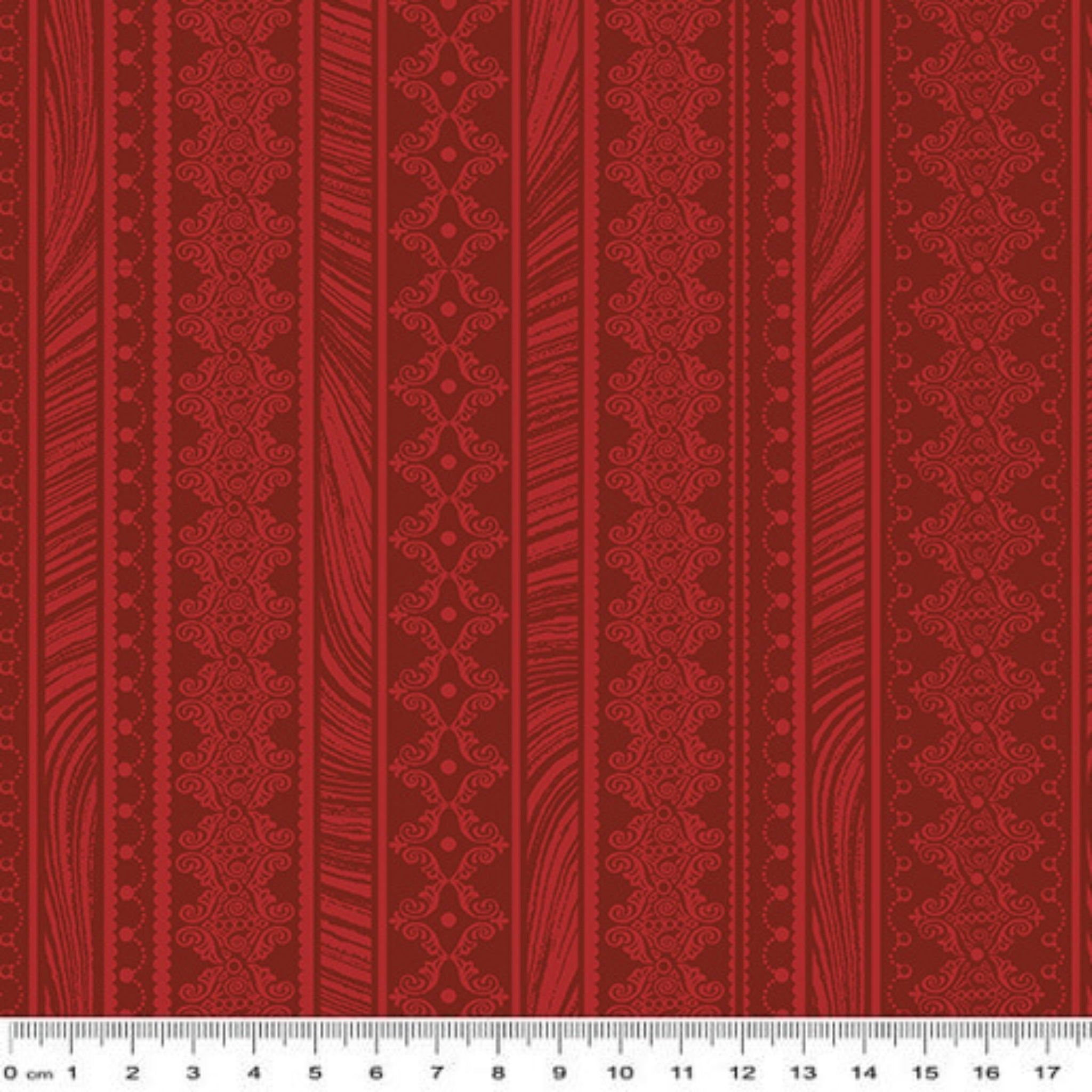 Tonal red fabric with vertical stripes of scrollwork and textured patterns