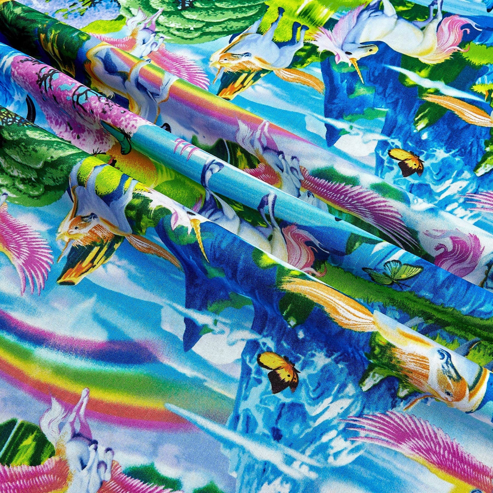 White unicorn pink pegasus fantasy landscape blue mountains waterfalls cherry blossom rainbows butterflies multicolour fabric for girls quilts and kids sewing projects